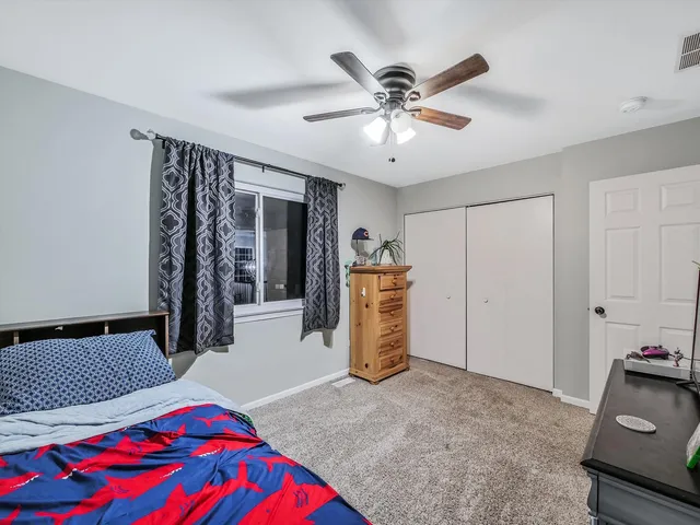 a bedroom with furniture and windows