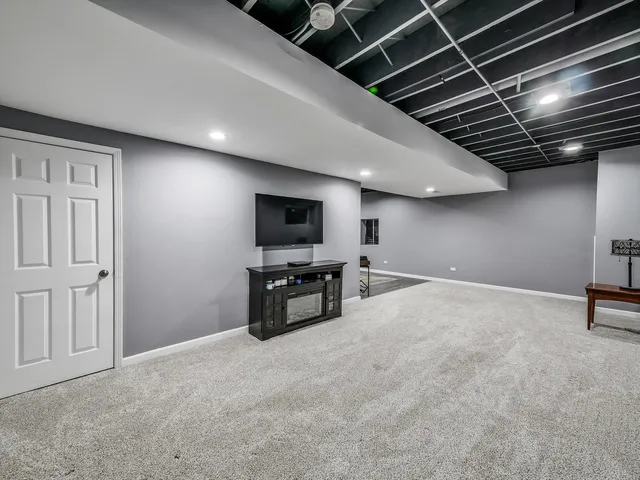 a view of game room with windows