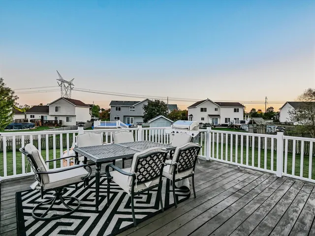 a view of a balcony with furniture