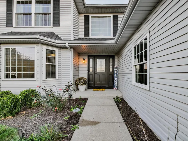 a front view of a house with windows