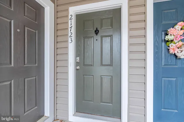 a view of a kitchen with furniture and wooden floor
