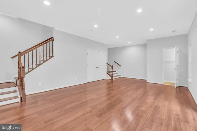 a kitchen with stainless steel appliances granite countertop a refrigerator a sink a stove a microwave and island