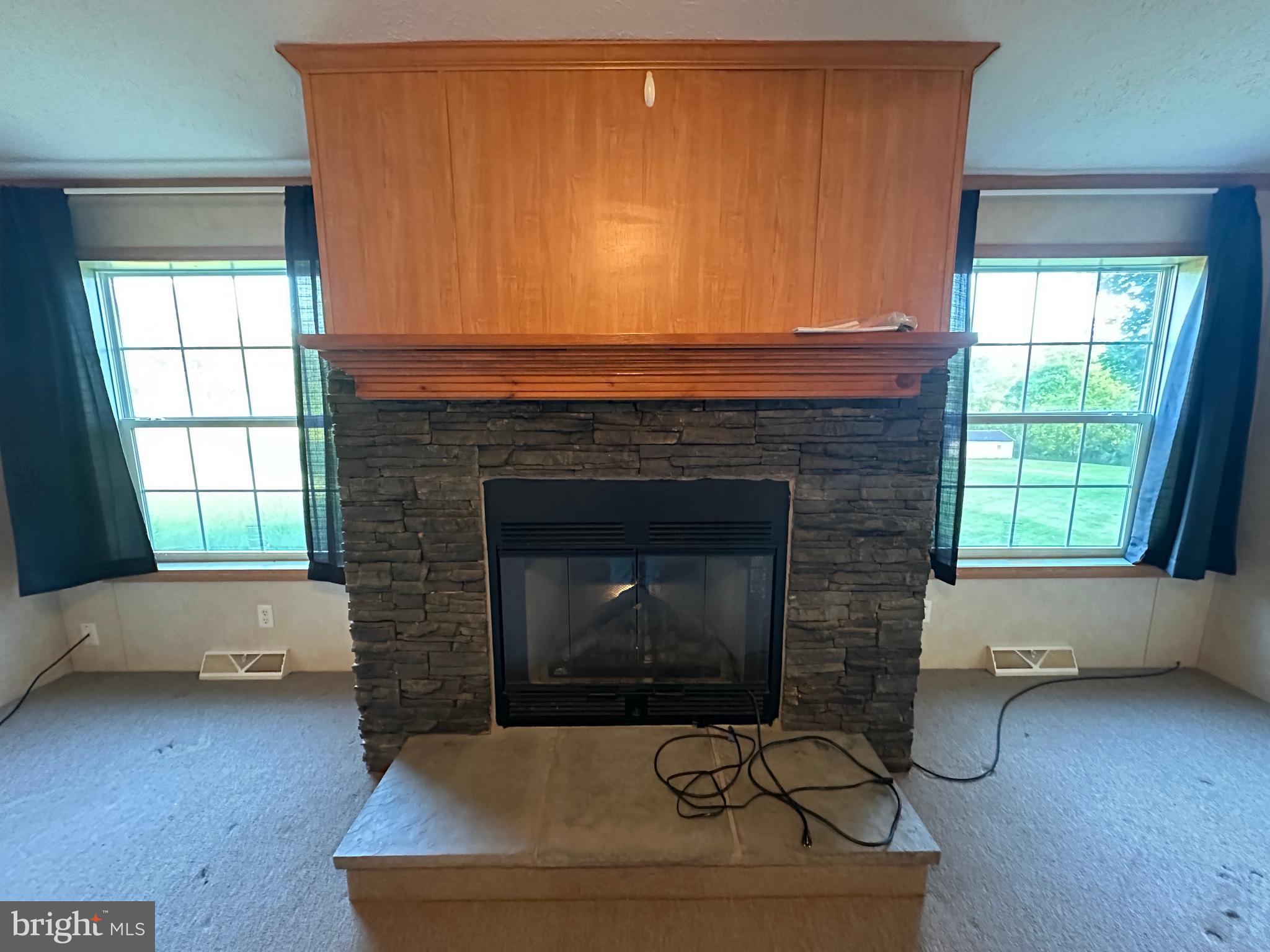 4391 Cito Road McConnellsburg, PA 17233 - Photo 33 of 67 a living room with furniture and a fireplace