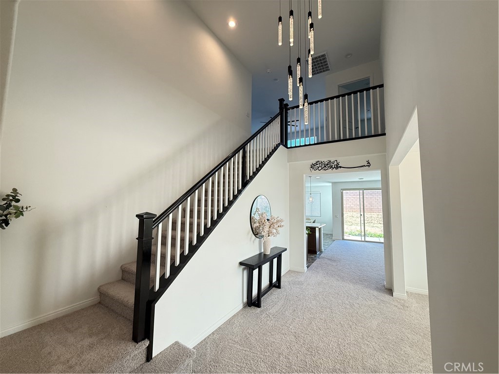 4461 Hickory Court Perris, CA 92571 - Photo 4 of 31 a view of staircase with railing and white walls
