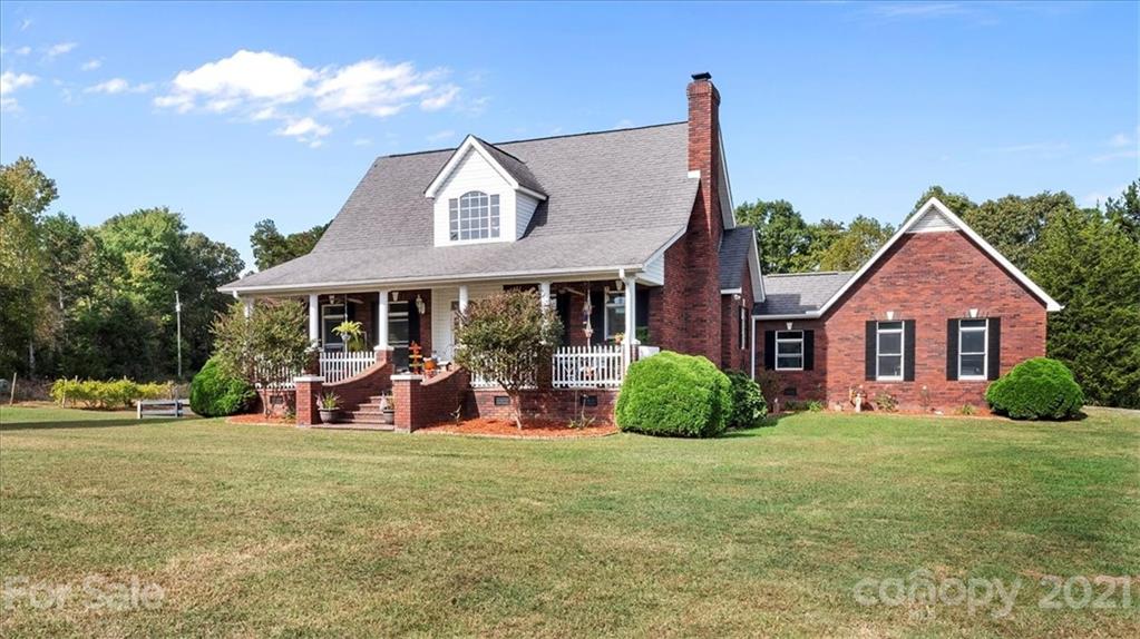 3928 Biggers Road Clover, SC 29710 - Photo 2 of 45 a front view of a house with garden