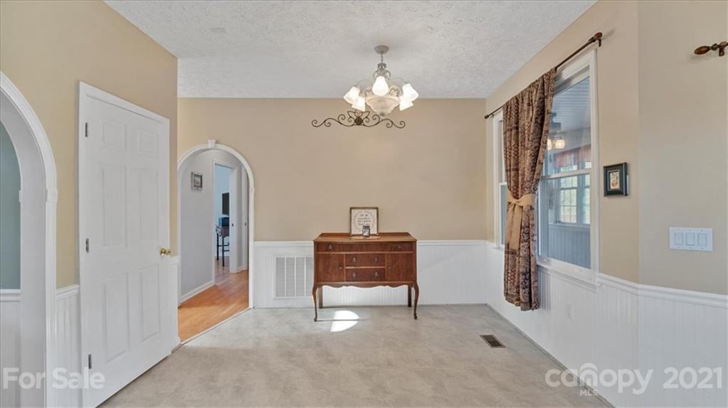 3928 Biggers Road Clover, SC 29710 - Photo 12 of 45 a view of a hallway with a chandelier