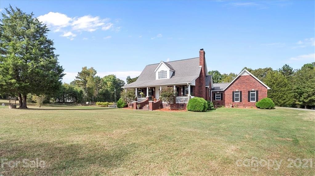 3928 Biggers Road Clover, SC 29710 - Photo 3 of 45 a front view of a house with a yard and garage