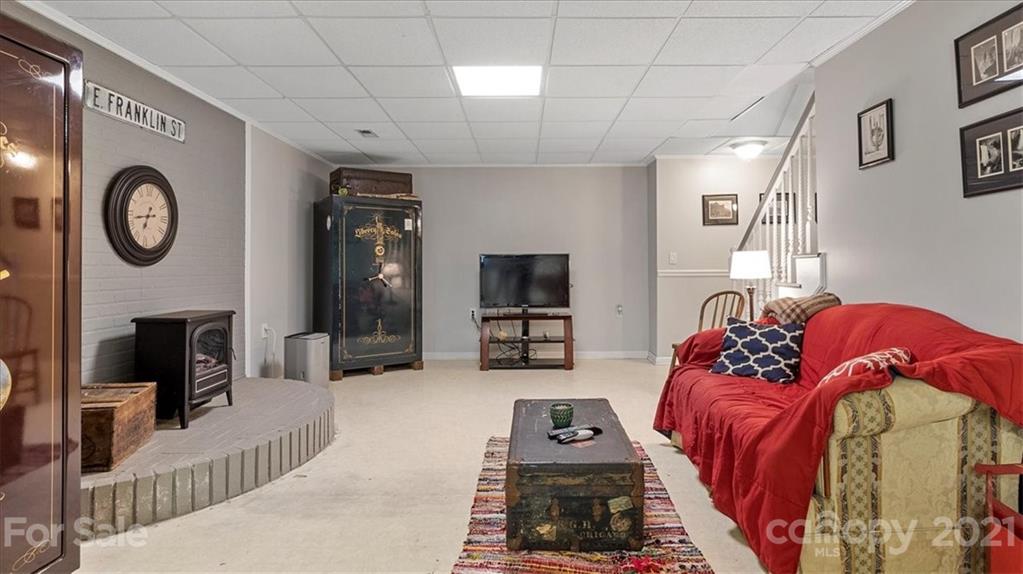 3928 Biggers Road Clover, SC 29710 - Photo 22 of 45 a living room with furniture a flat screen tv and a fireplace