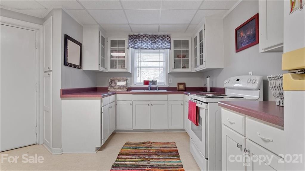 3928 Biggers Road Clover, SC 29710 - Photo 24 of 45 a kitchen with cabinets appliances a sink and a window