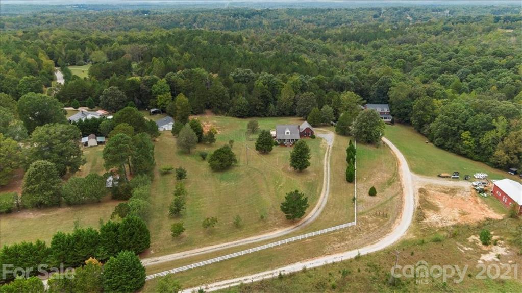 3928 Biggers Road Clover, SC 29710 - Photo 39 of 45 an aerial view of residential house with pool and trees