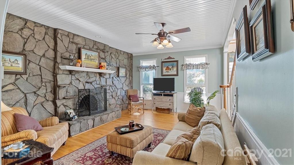 3928 Biggers Road Clover, SC 29710 - Photo 5 of 45 a living room with furniture a flat screen tv and a fireplace
