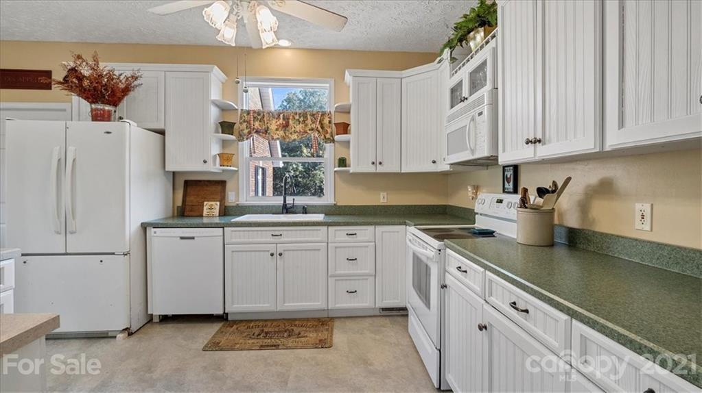 3928 Biggers Road Clover, SC 29710 - Photo 8 of 45 a kitchen with cabinets appliances and a counter top space