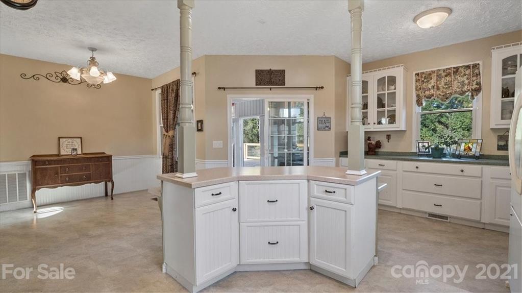 3928 Biggers Road Clover, SC 29710 - Photo 9 of 45 a kitchen that has a lot of cabinets in it and a window