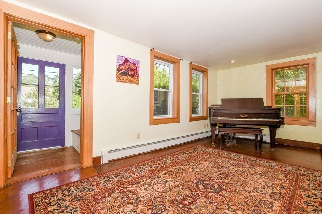 56 Marion Road Rochester, MA 02770 - Photo 12 of 39 a living room with furniture and a window