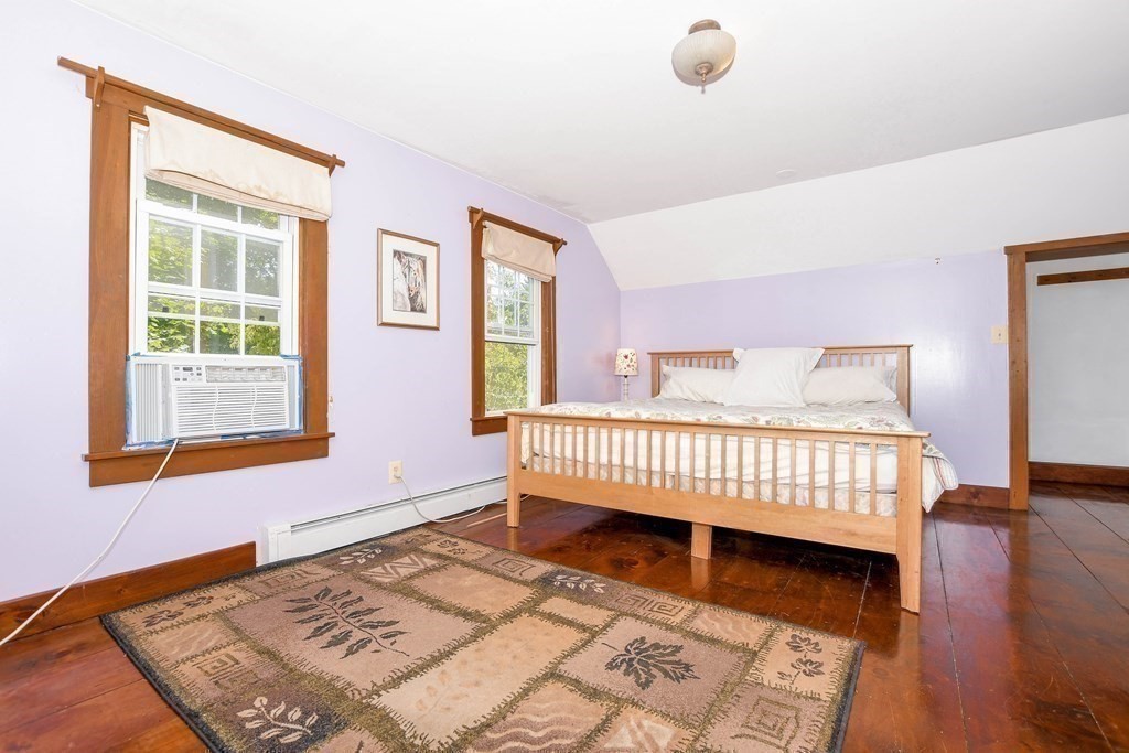 56 Marion Road Rochester, MA 02770 - Photo 16 of 39 a bedroom with a bed and a window