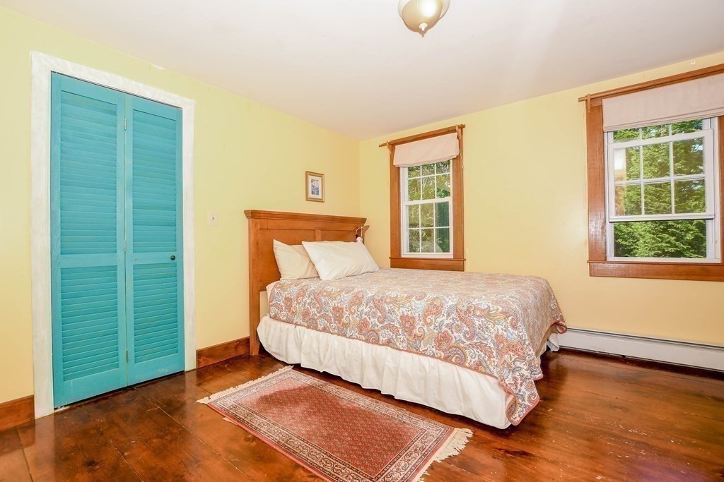 56 Marion Road Rochester, MA 02770 - Photo 21 of 39 a bedroom with a bed and a window