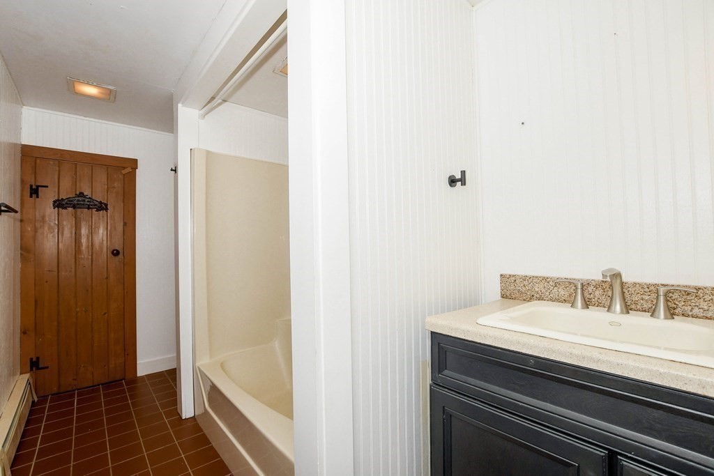56 Marion Road Rochester, MA 02770 - Photo 22 of 39 a bathroom with a sink and a mirror