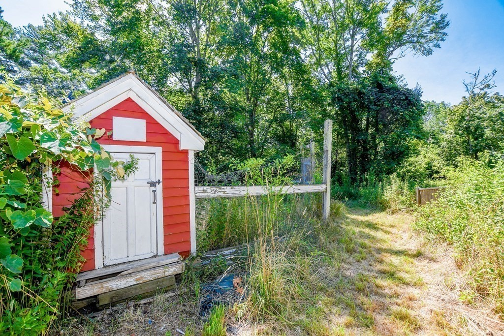 56 Marion Road Rochester, MA 02770 - Photo 27 of 39 a view of a house with pool and garden
