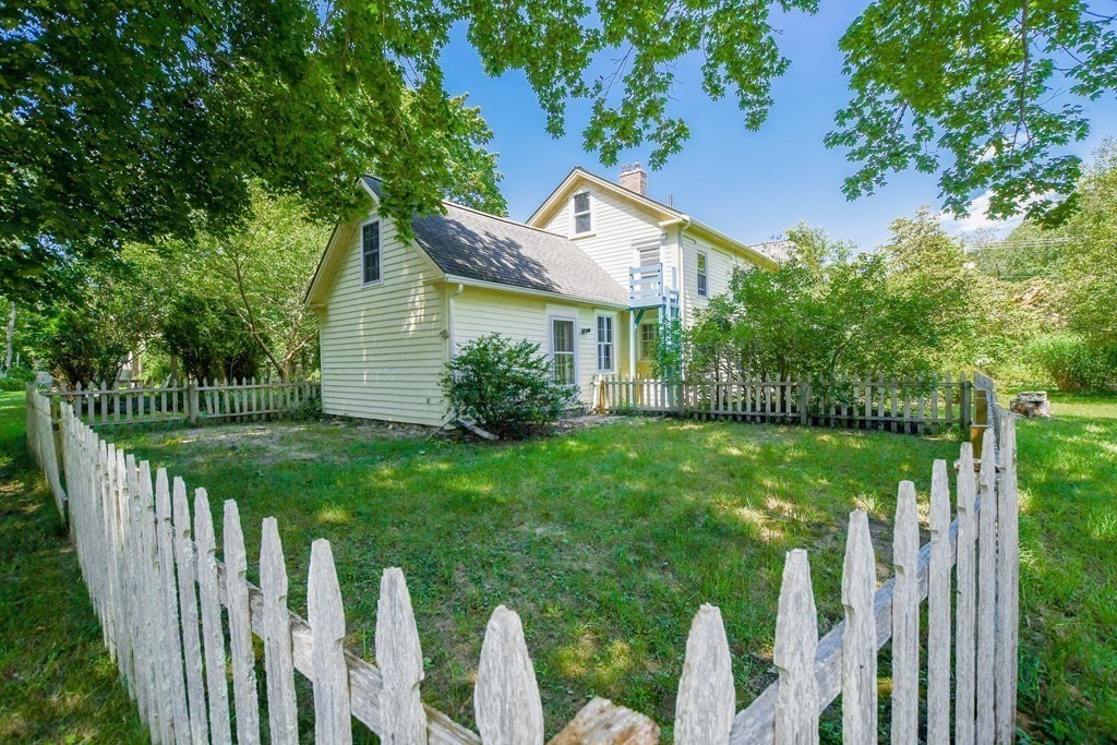 56 Marion Road Rochester, MA 02770 - Photo 3 of 39 a view of an house with backyard and a tree