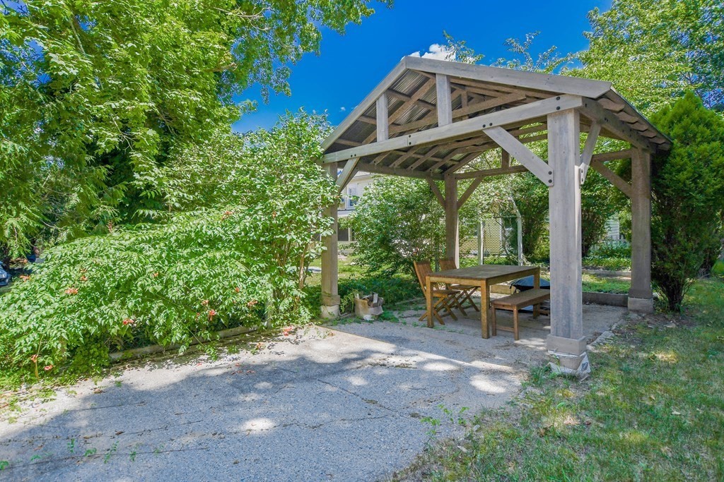 56 Marion Road Rochester, MA 02770 - Photo 33 of 39 a view of a chair and table in the garden