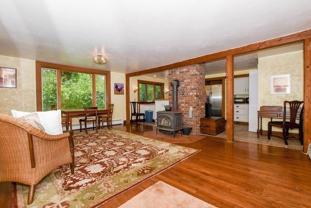 56 Marion Road Rochester, MA 02770 - Photo 5 of 39 a living room with furniture and large windows
