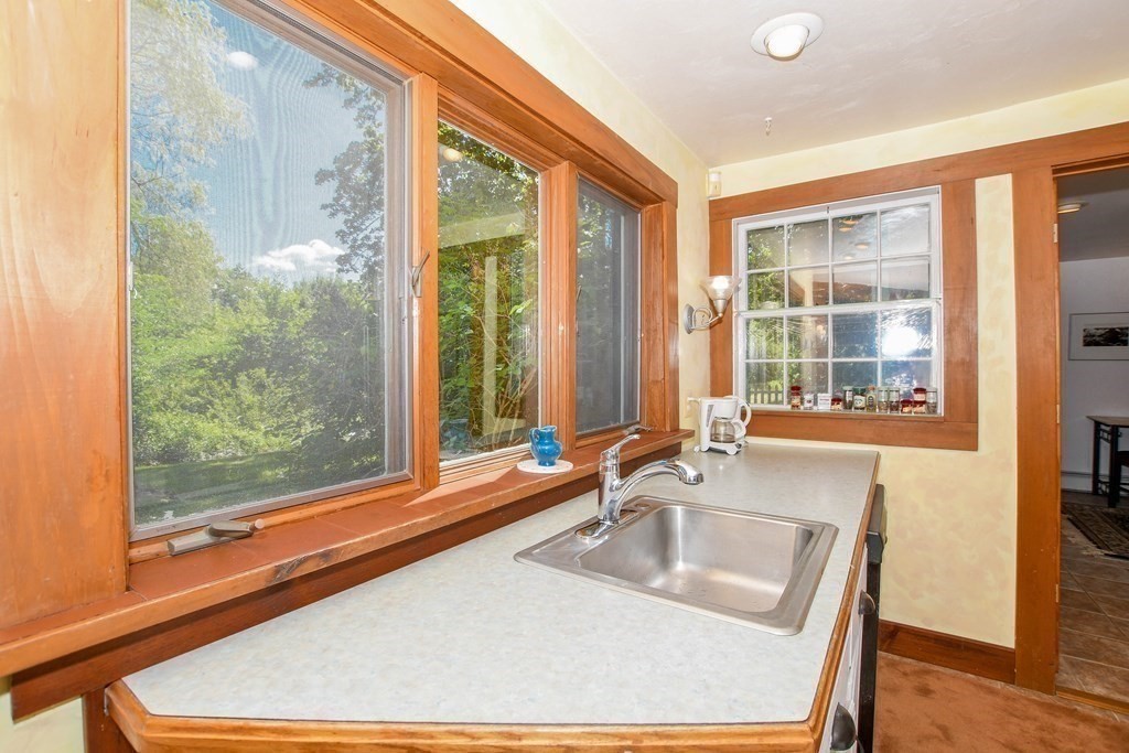 56 Marion Road Rochester, MA 02770 - Photo 10 of 39 a bathroom with a sink and a large window