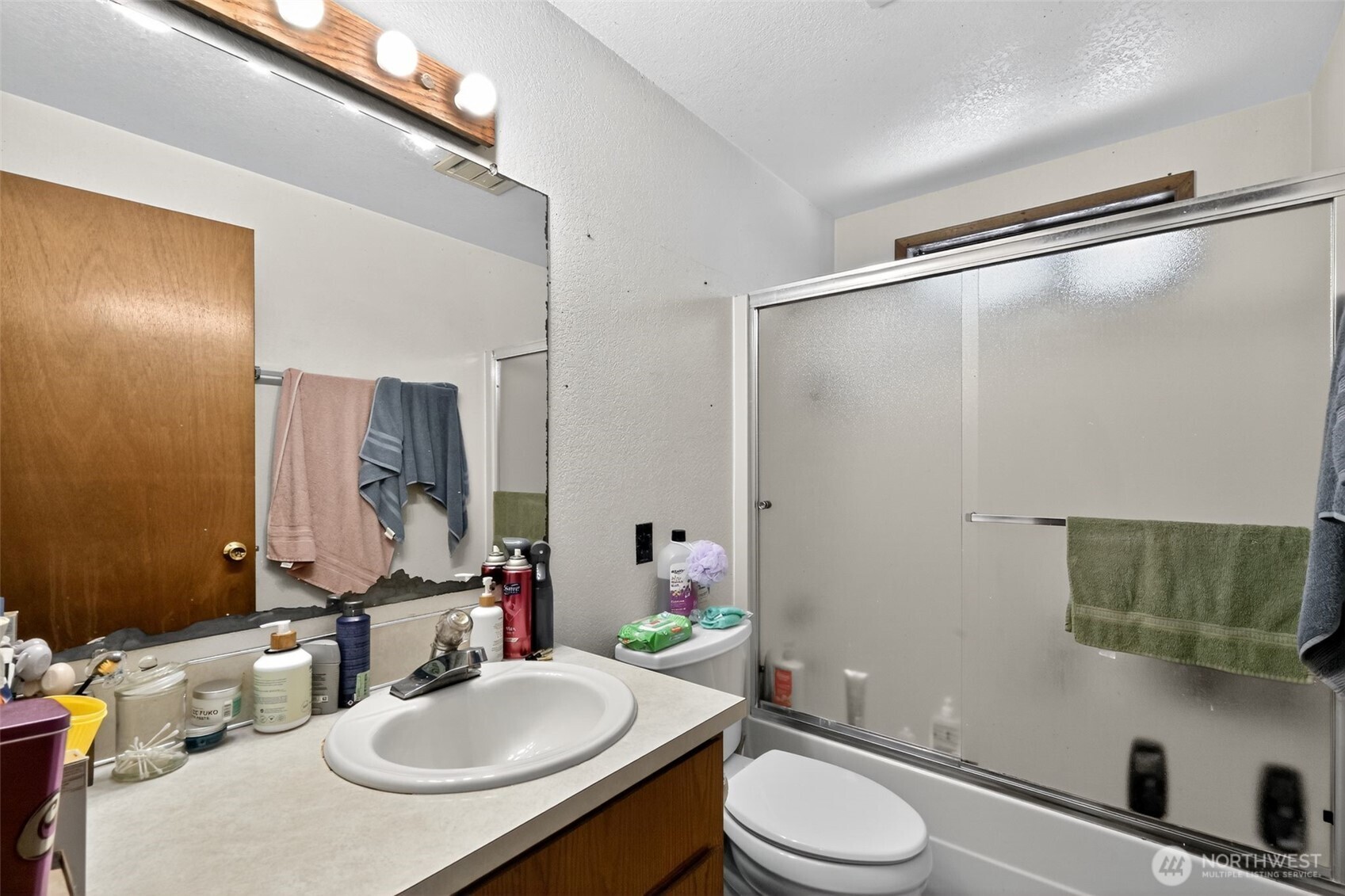 410 10th Street Lynden, WA 98264 - Photo 12 of 28 a bathroom with a sink toilet and shower