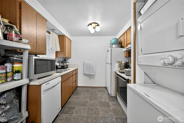 a kitchen with a sink cabinets and stainless steel appliances