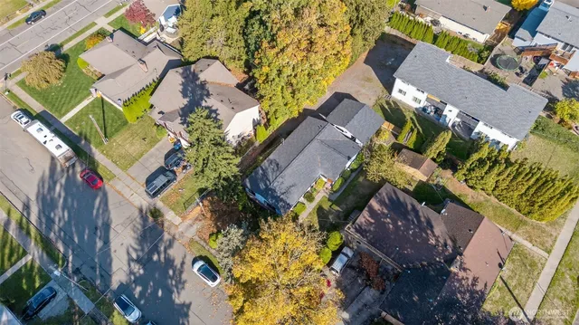 an aerial view of a house with a yard