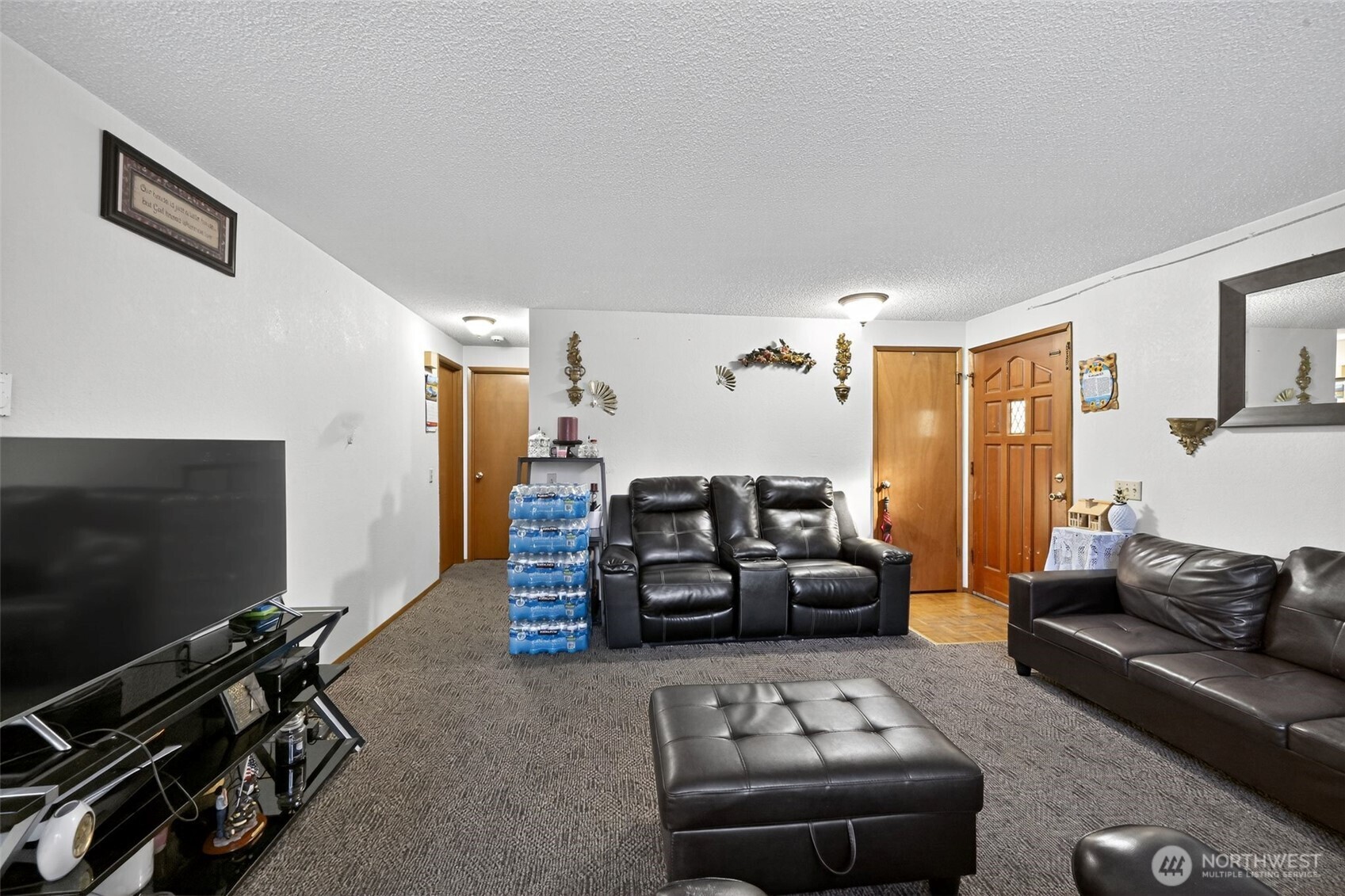 410 10th Street Lynden, WA 98264 - Photo 4 of 28 a living room with furniture and a flat screen tv