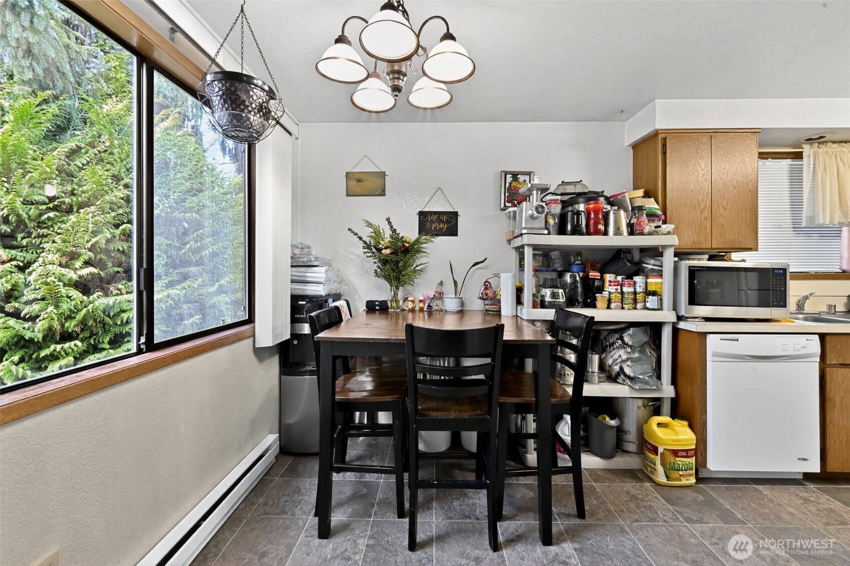 410 10th Street Lynden, WA 98264 - Photo 6 of 28 a view of a dining room with furniture window and wooden floor