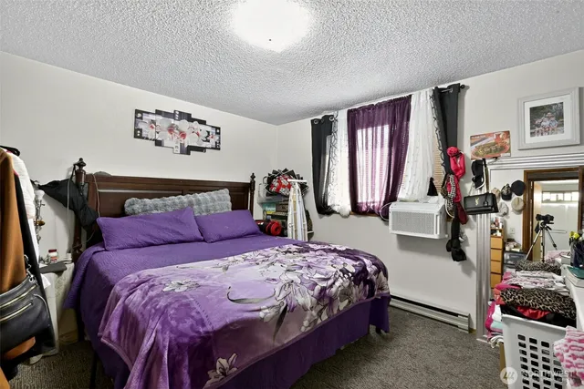 a bedroom with a bed and walk in closet