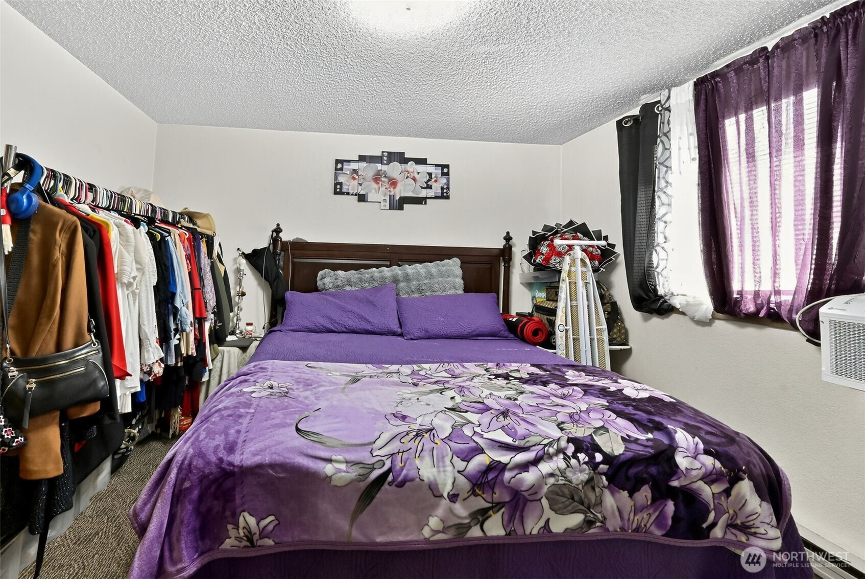 410 10th Street Lynden, WA 98264 - Photo 10 of 28 a bed sitting in a bedroom next to a window