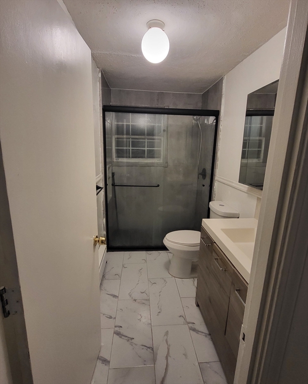 1 Walker Road, Unit 1 North Andover, MA 01845 - Photo 4 of 8 a bathroom with a toilet and a shower