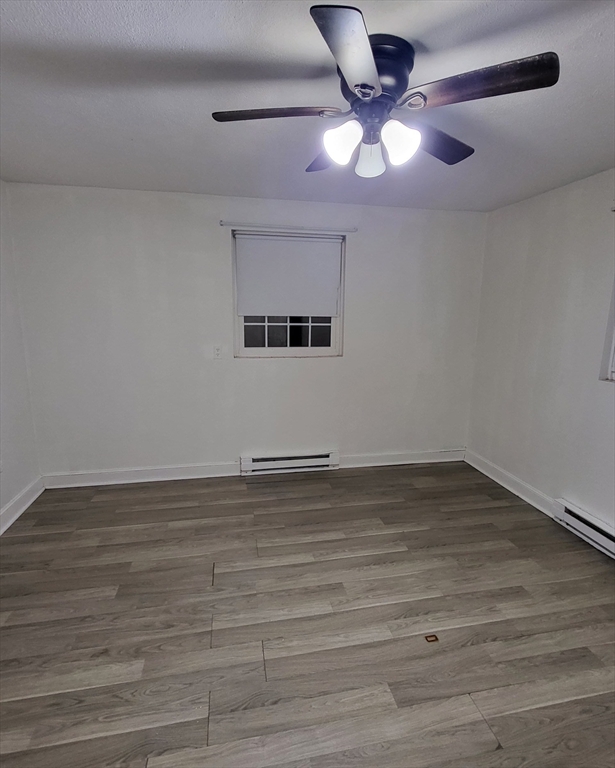 1 Walker Road, Unit 1 North Andover, MA 01845 - Photo 7 of 8 a view of an empty room with a chandelier fan
