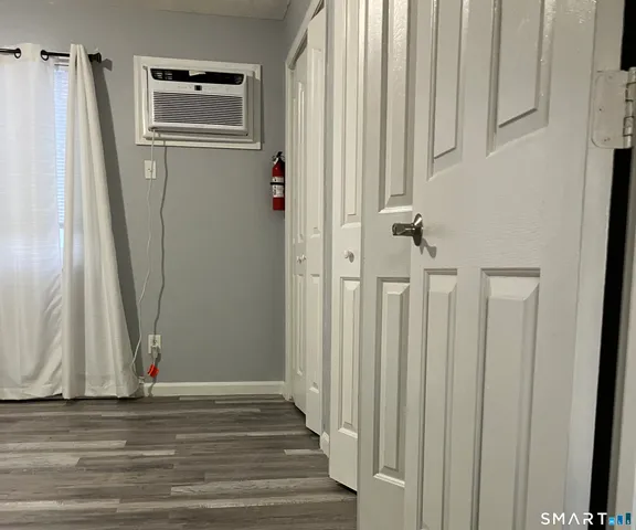 a bathroom with a sink a toilet a mirror and shower