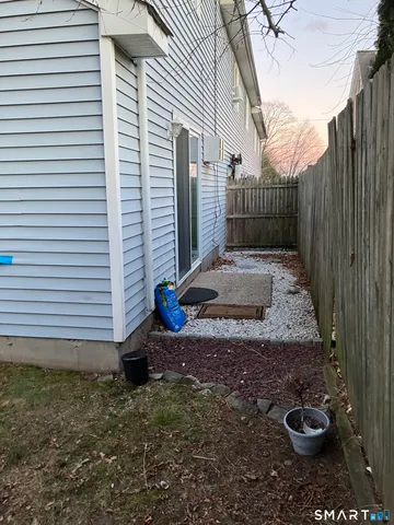 a view of a room with wooden floor and a window