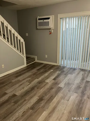 a bathroom with a sink mirror and toilet