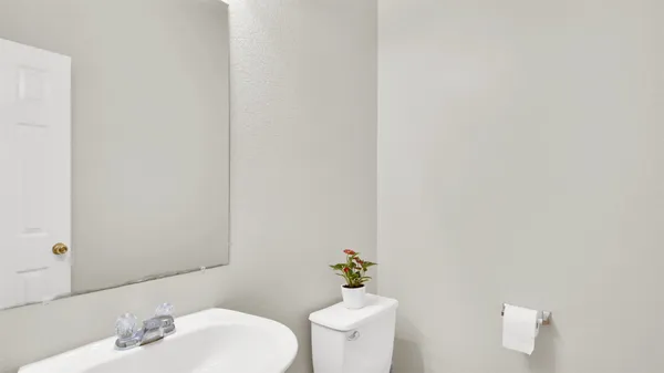a bathroom with a toilet and a sink