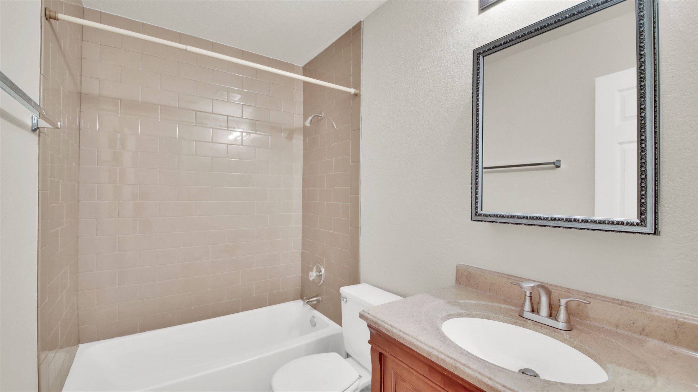 73 Verde Ranch Loop Leander, TX 78641 - Photo 27 of 29 a bathroom with a granite countertop sink toilet and shower