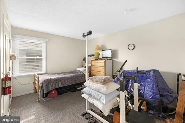 a bedroom with a bed and a closet