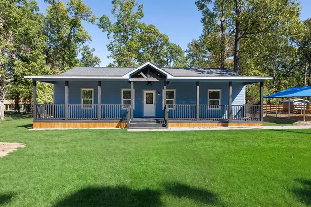 a view of house with a swimming pool