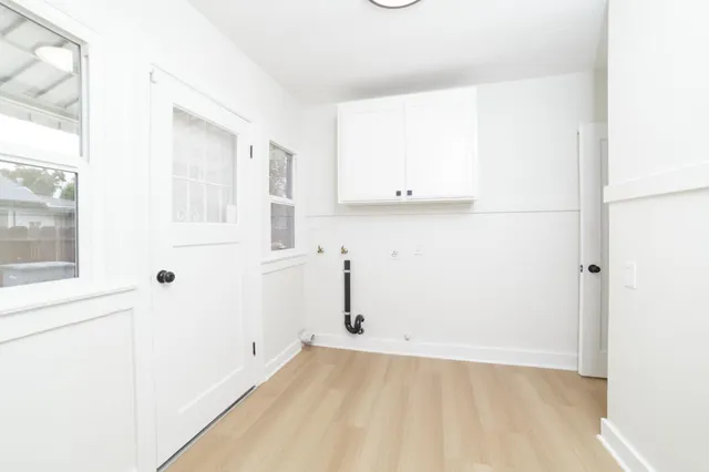 a view of a room with white walls