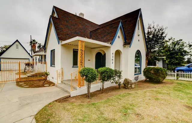 a view of a white house with a outdoor space
