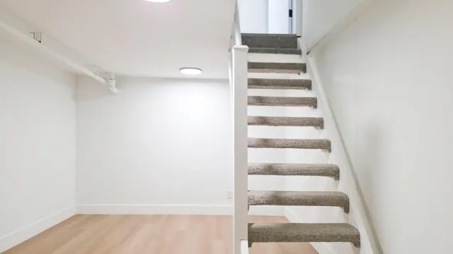 a view of staircase with white walls