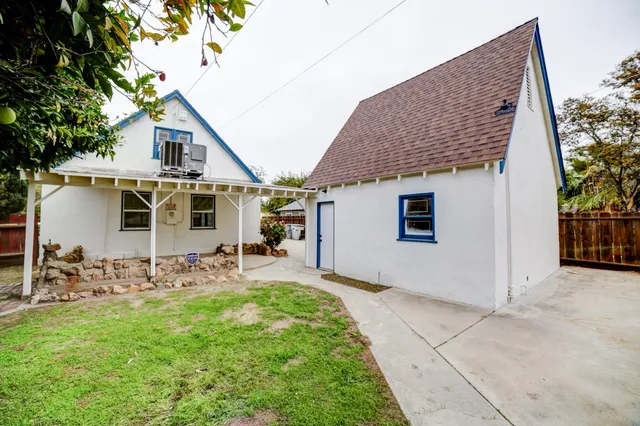 a front view of house with yard and seating space