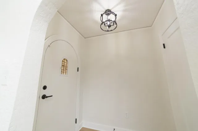 a view of a hallway with paintings on the wall