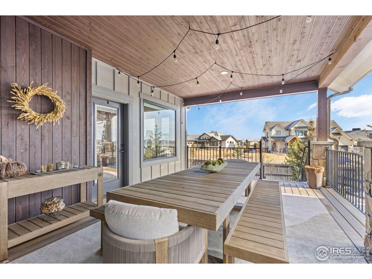 2734 Southwind Road Berthoud, CO 80513 - Photo 19 of 50 Covered Deck Provides Access to Firepit and Backyard