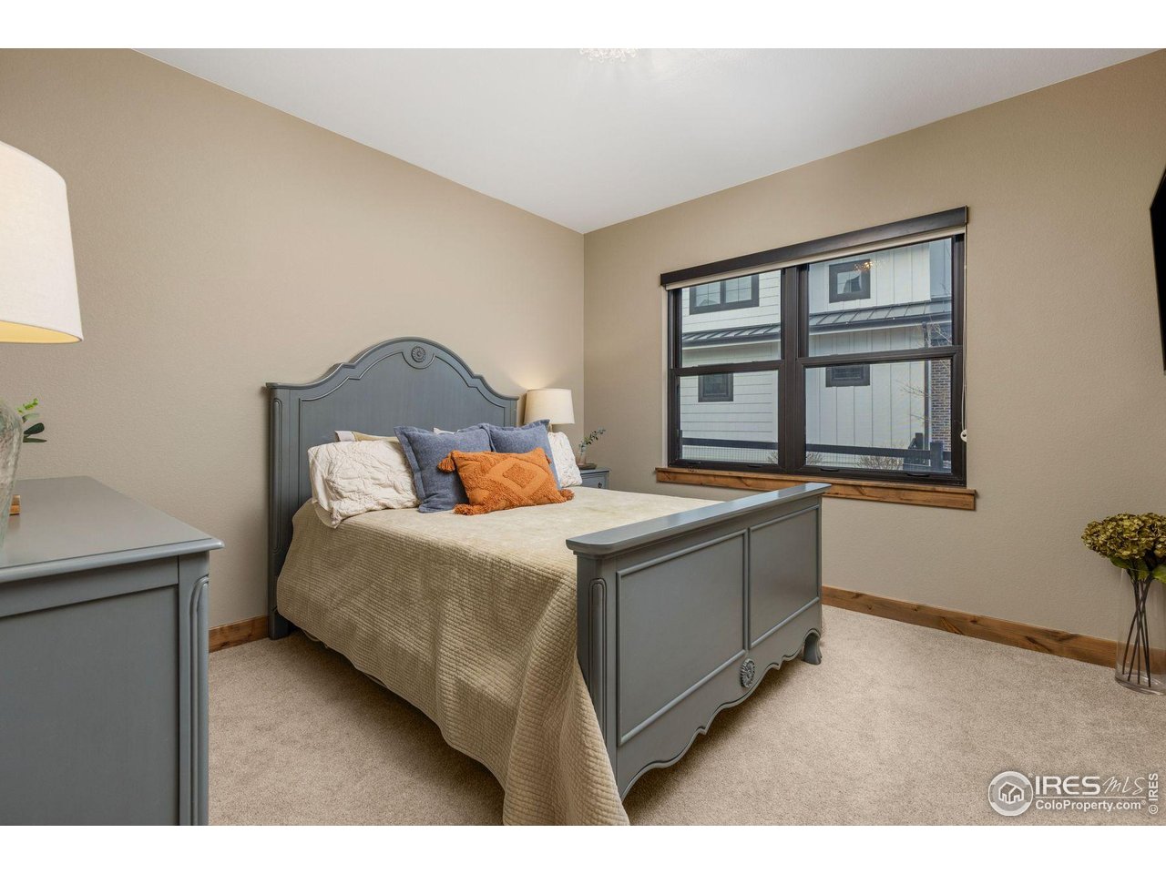 2734 Southwind Road Berthoud, CO 80513 - Photo 21 of 50 Main Floor Guest Bedroom with En Suite Bathroom & Walk-in Closet