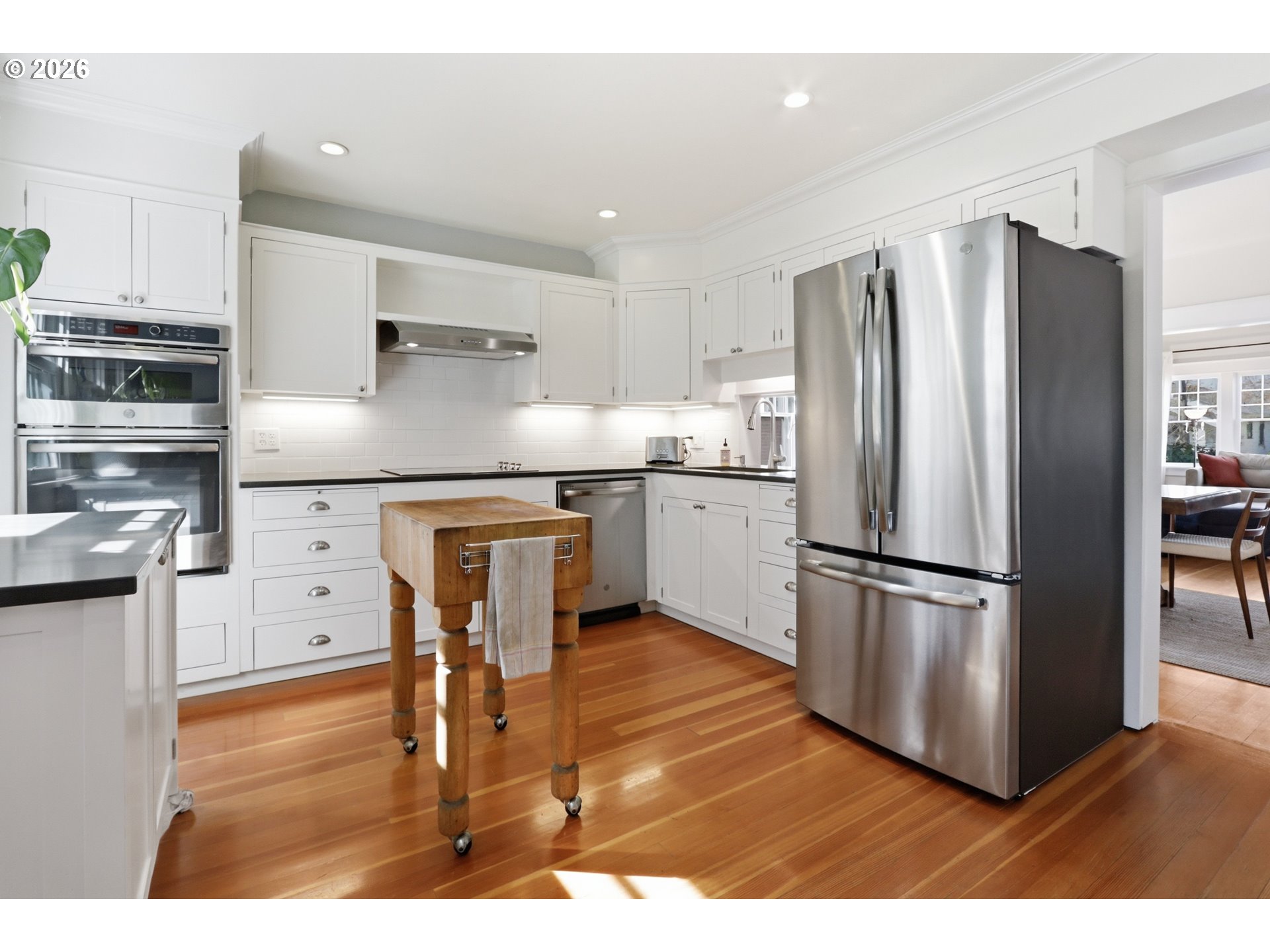 3326 Northeast 60th Avenue Portland, OR 97213 - Photo 13 of 46 a kitchen with stainless steel appliances a refrigerator stove microwave and cabinets